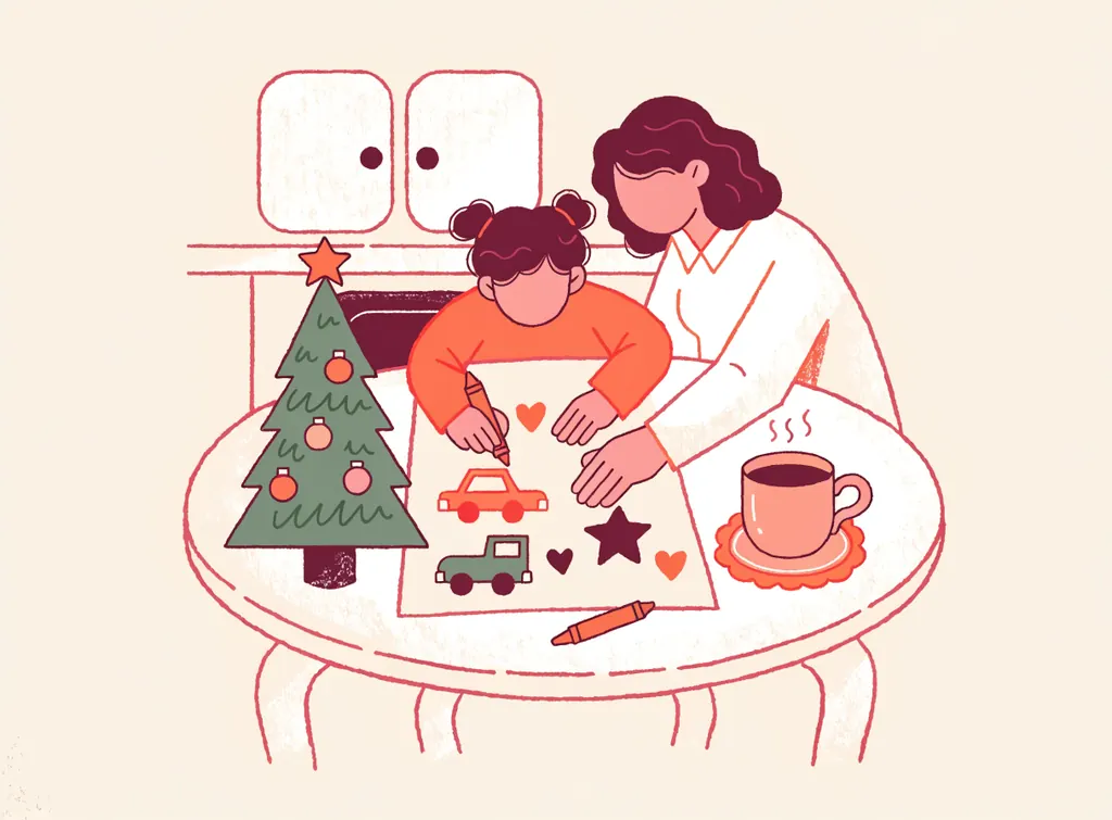 Un enfant dessine sa lettre au Père Noël (voitures, étoile, cœurs) avec l'aide d'un parent, à côté d'un petit sapin et d'une tasse de chocolat chaud