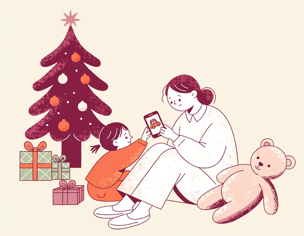Un parent et un jeune enfant assis au pied du sapin : l'enfant montre un jouet sur le téléphone du parent, entouré de cadeaux et d'un ours en peluche